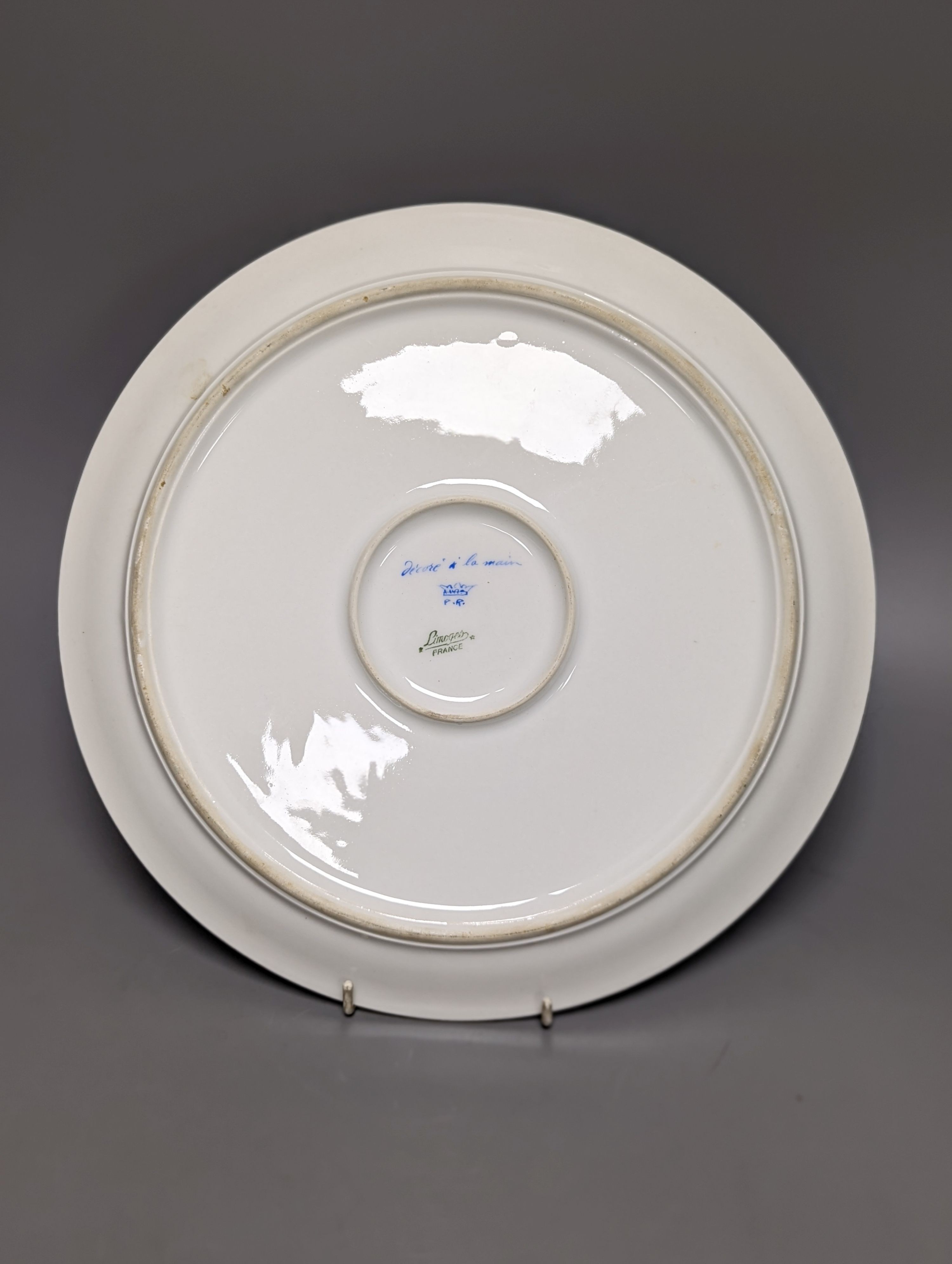 A Sevres style boat shaped dish and a Limoges circular dish, Sevres dish 27 cms wide & Limoges dish 31 cms diameter.